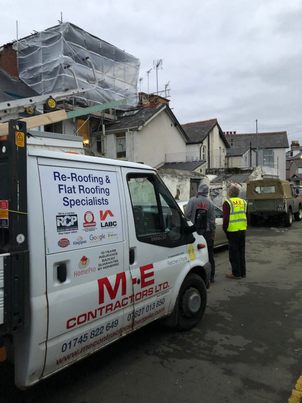 M E Contractors North Wales roofer on scaffolding.